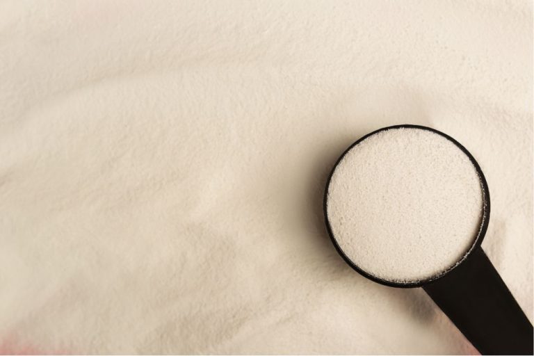 Scoop of collagen powder supplement in container – best collagen supplements for joint, skin, and muscle support.