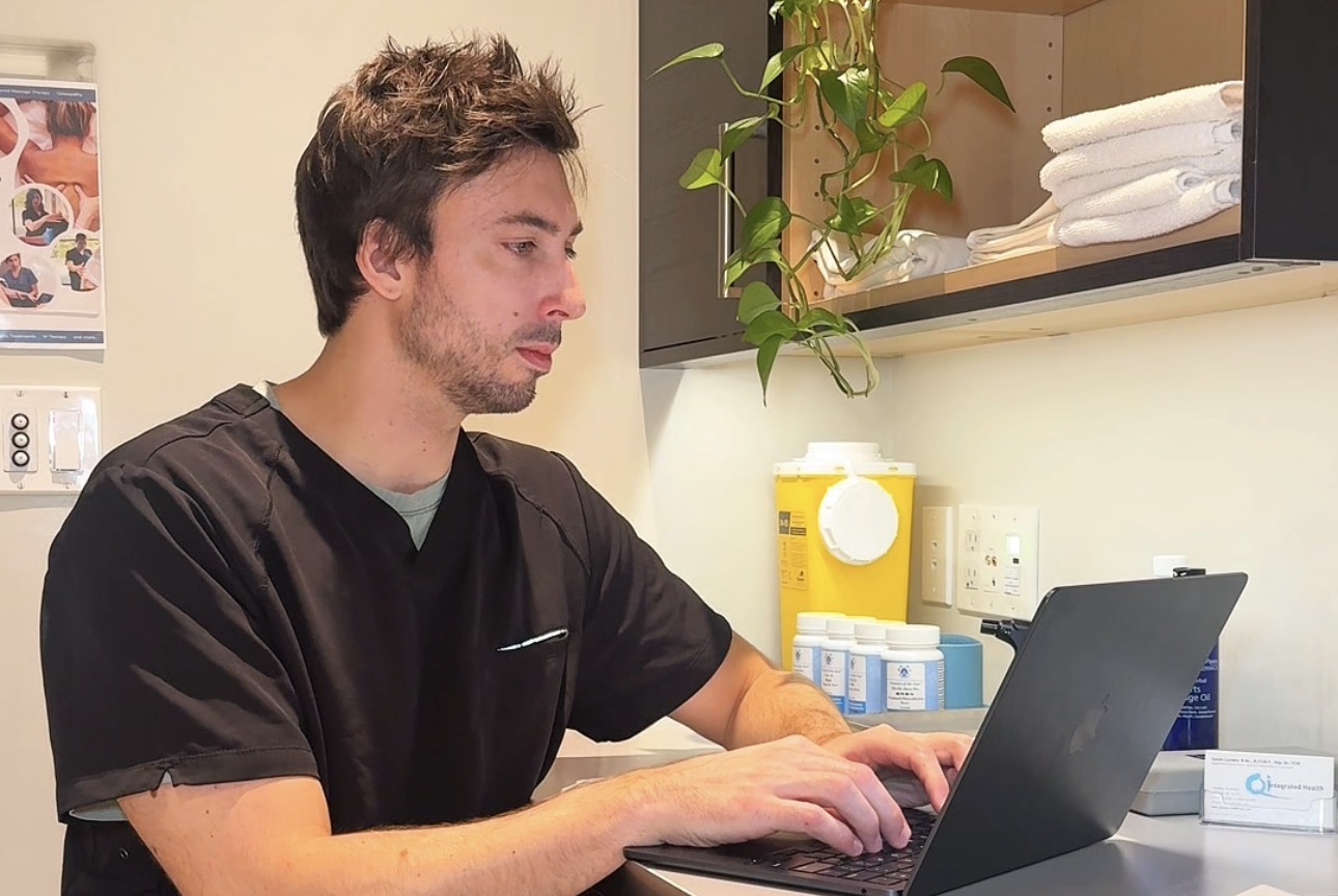 Gavin Larsen working at his desk